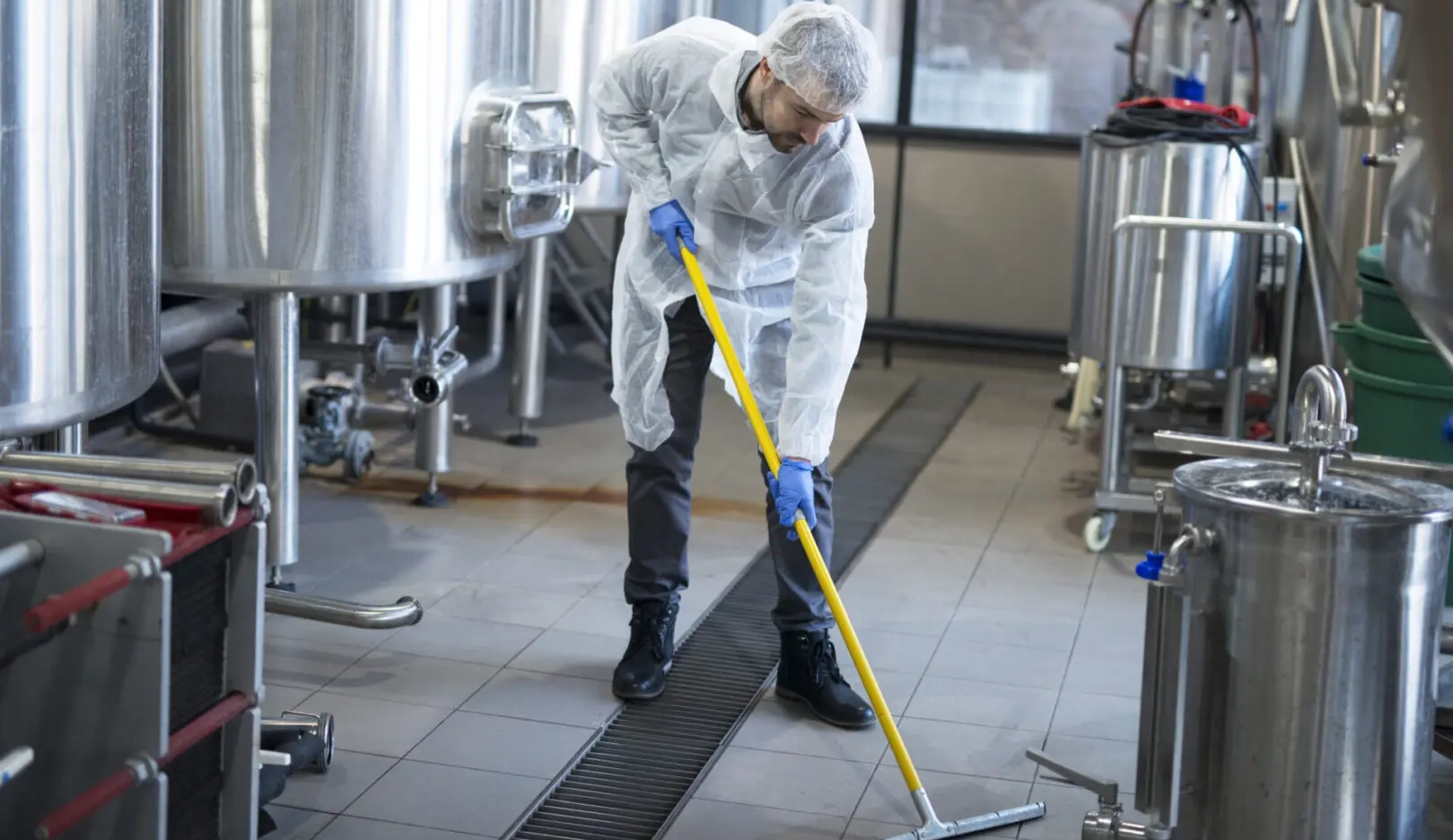professional-cleaner-wearing-protection-uniform-cleaning-floor-production-plant-scaled professional-cleaner-wearing-protection-uniform-cleaning-floor-production-plant-scaled